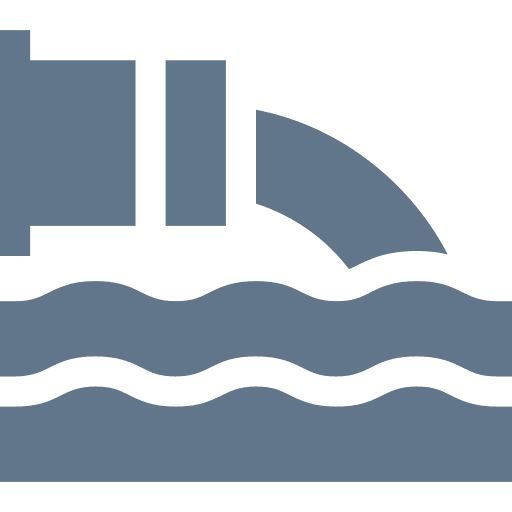Pipe discharging into water with waves.